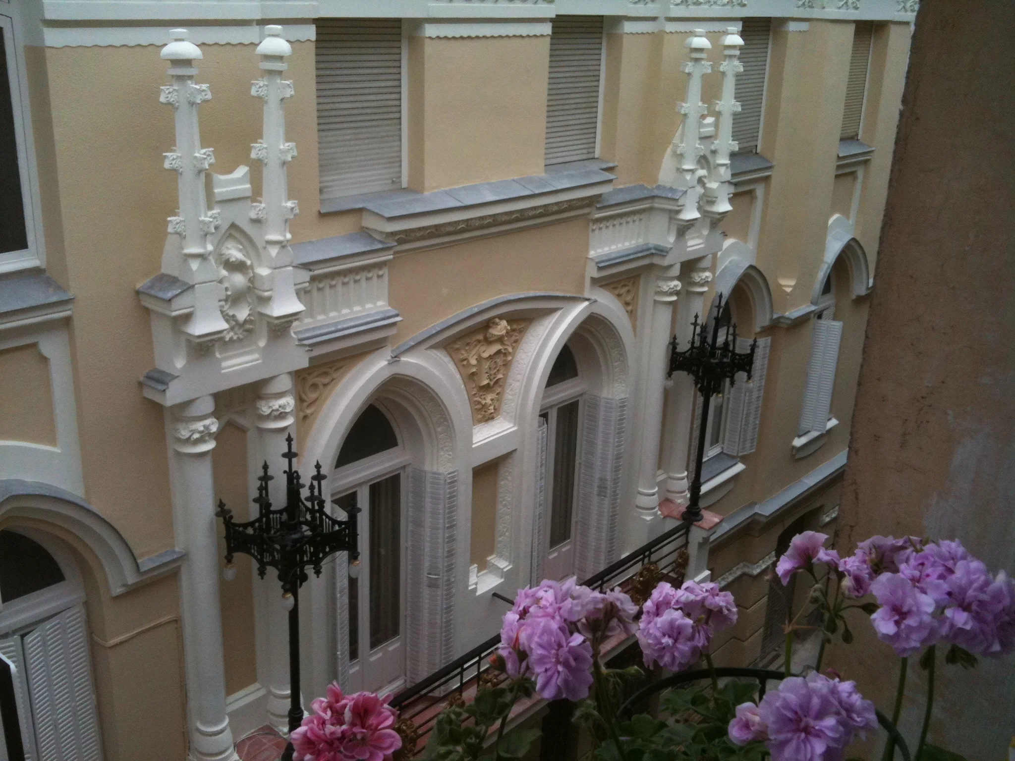Elegant historic building courtyard viewed from upper balcony